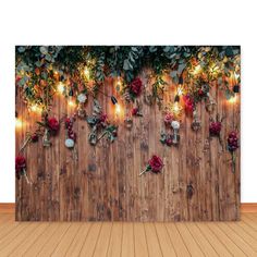 a wooden wall with flowers and lights on it