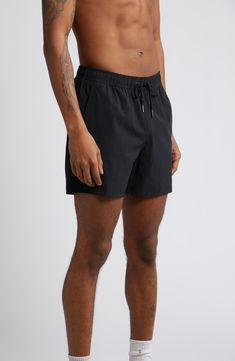 Quick-drying swim trunks feature a built-in liner and natural odor resistance, plus pockets that drain so your swims won't get bogged down. 5" inseam; 24" front rise; 11" front rise; 14" back rise (size Medium) Elastic/drawstring waist Side-seam pockets; back zip pocket Water-repellent Lined 88% recycled nylon, 12% spandex Machine wash, tumble dry Imported Recycled Polyester Swim Trunks With Built-in Shorts For Beach, Black Bottoms With Built-in Shorts For Water Sports, Sporty Relaxed Fit Athletic Shorts For Swimming, Functional Beach Swim Trunks Relaxed Fit, Relaxed Fit Functional Swim Trunks For Beach, Functional Relaxed Fit Swim Trunks For Beach, Sporty Swimwear In Recycled Polyester For Sports, Sporty Recycled Polyester Swimwear For Sports, Lightweight Black Summer Bottoms