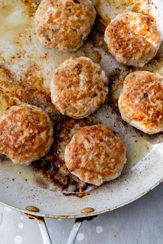 cooked meatballs in a frying pan on a table