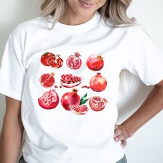 Introducing the Pomegranate Fruit Comfort Colors Shirt, a delightful vintage-inspired tee adorned with a retro graphic featuring ripe pomegranates. This y2k summer shirt is a cute and trendy gift for her, blending a comfortable crewneck style with the charming appeal of cottagecore. Designed for women who appreciate unique fruit-themed apparel, this graphic tee from the comfort colors collection is both fashionable and comfortable. Embrace the nostalgic charm of vintage fashion with this essenti Fruit Shirt, Trendy Crewneck, Cottagecore Shirt, Pomegranate Fruit, Cute Gifts For Her, Crewneck Style, Y2k Summer, Comfort Colors Shirt, Tees For Women