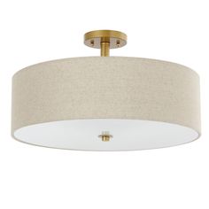 a light fixture with a beige drum shade