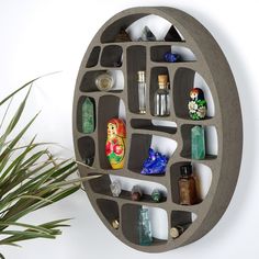 a circular shelf with various items on it