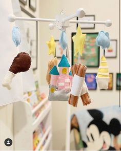 some toys hanging from a rack in a room