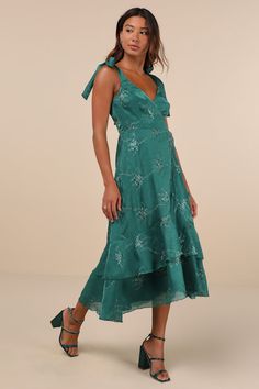 Head to the event knowing your look is bound to impress when you're wearing the Lulus Elegant Direction Green Embroidered Ruffled Tie-Strap Midi Dress! Lightweight woven fabric boasts a vintage-inspired pattern of floral embroidery as it shapes tying shoulder straps and a surplice bodice with princess seams. Fitted waist tops an overlapping skirt that has tiers of ruffled trim, ending at a midi hem. Hidden zipper/clasp at back. Fit: This garment fits true to size. Length: Mid-calf length. Size m Tie Strap Dress, Embroidered Midi Dress, Adhesive Bra, Half Skirt, Princess Seams, Gowns Of Elegance, Reception Dress, Lulu Dresses, Petite Women