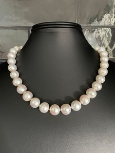 Freshwater Single Strand Bridal Pearl Necklace. This beautiful necklace is the epitome of class. One unique strand of hand strung and individually knotted pearls. The luster is very good. All of the pearls are beautifully matched for luster, color and overtone. 18 inch, with a sterling silver toggle clasp. Quality pearl necklaces are always knotted between the pearls. The necklace is double hand-knotted with silk thread. This protects the pearls from rubbing together and becoming damaged. All pe Cheap Vintage Single Strand Pearl Necklace, Elegant Adjustable Hand-strung Pearl Necklace, Single Strand Round Pearl Necklace Gift, Single Strand Pearl Necklace Gift, Single Strand Round Pearl Necklace As Gift, Classic Single Strand Round Pearl Necklace, Classic Single Strand Pearl Necklace, Elegant Adjustable Pearl Necklace With Sterling Silver Clasp, Adjustable Pearl Charm Necklace For Formal Occasions