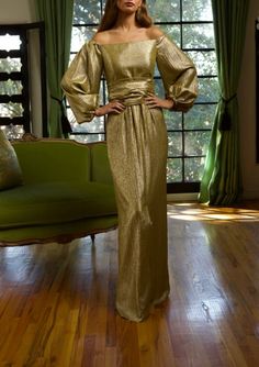 Known for using exquisite textiles from the finest European mills, Barbara Tfank’s collections are classic and timeless in French brocades, Italian silks, intricate jacquards, and more. Cut in an alluring silhouette with an off-the-shoulder neckline, this full-sleeve dress radiates in Taroni gold silk lamé. The waistline cinches with a fabric belt. Product Details Silk poly-blend. Please contact customercare@overthemoon.com if you are interested in a made-to-measure order. Care Instructions Dry-clean only. Size & Fit This item fits true to size. Shipping Details This item is made-to-order. Please allow 8-10 weeks for production and 5-7 business days for standard delivery. Return Policy This item is final sale and not available for return. Barbara Tfank, Full Sleeve Dress, Full Sleeves Dress, Gold Silk, Fabric Belt, Full Sleeve, Sleeve Dress, Final Sale, Off The Shoulder