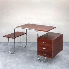 an office desk with two drawers on each side and a metal frame around the top