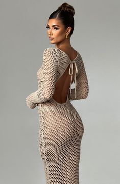 Long, balmy days that turn into nights call for Moana, our premium sheer knit maxi with an eye-catching low back and high neckline. This stunning design is super flattering with long flared cuffs.. Pair with soft, textured hair, golden accessories and heeled sandals.


Colour: Beige.

Sheer knit fabric.

Long sleeves with flared cuffs.

Tie at top of neck.

Super low back.

High neck.

Maxi length.

Model is an XS and is wearing an XS. Model is an F-cup size.

 Size: XS, S, M, L, XL, XXL Homecoming Dresses Corset, White Dress Spring, Midi Dress Wedding Guest, Long Sleeve Homecoming Dresses, Split Long Dress, Homecoming Dresses Long, Maxi Dress Sale, Sparkle Dress, Maxi Dress Navy