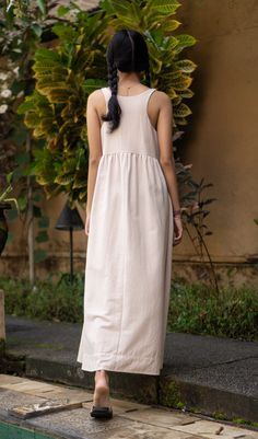 This beautiful dress, made of a linen textured cotton, is great to throw on over a bathing suit, to go shopping or out to dinner. With its wide flowing skirt feel free to do ballet, and it has pockets. It was made with care in our fair trade, in-house workshop in Bali. Hand or machine wash cold, tumble dry on low heat or line dry. Andrea & Lucy design each of our relaxed, versatile pieces to be part of a classic, timeless, minimalist wardrobe.100% Cotton - Hand or machine wash warm, tumble dry low Pictured: Size S on Saras: Size 2 US (XS) • Height 5’5” (164cm) SizesSmall: women's 4-6.Medium: women's 8-10.Large: women's 12-14. Minimalist Wardrobe, Flowing Skirt, Romantic Dress, Dress Cotton, Guinea Bissau, British Indian, Mozambique, Beautiful Dress, Go Shopping