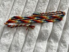 Rainbow stripe bracelet. Many beautiful colors and handmade to fit any wrist. Handmade Multicolor Friendship Wristband, Multicolor Jubilee Friendship Bracelets, Multicolor Braided Jubilee Friendship Bracelets, Multicolor Friendship Wristband, Handmade Casual Band Bracelet, Handmade Rainbow Bracelets For Friendship, Multicolor Braided Bangle Bracelets For Friendship, Adjustable Multicolor Jubilee Bracelet, Handmade Multicolor Unique Braided Bracelets