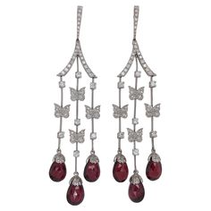 These Exquisite and dangling are crafted by Carrera Y Carrera Earrings from Butterfly Collection in 18kt White Gold with Diamonds & Rubellites Can also be bought with a gorgeous matching pendant drop necklace as seen on the photographs. Material: 18kt white gold Diamonds: Brilliant cut diamonds, together approx. 2.5ct Stone: Red Rubellite Total weight : 20.8 gr / 0.735 oz / 13.4 dwt Measurements: 85 mm x 17.2 mm x 3 mm Carrera Y Carrera, Butterfly Collection, Earrings Butterfly, Polki Jewellery, South Indian Jewellery, Art Deco Necklace, Jewellery Earrings, Silver Choker, Oxidised Jewellery