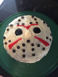 a cake decorated to look like a hockey mask with chocolate chips on the top and eyes