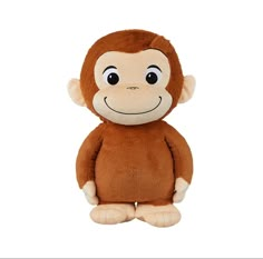 a brown stuffed monkey with big eyes and a smile on its face, sitting in front of a white background