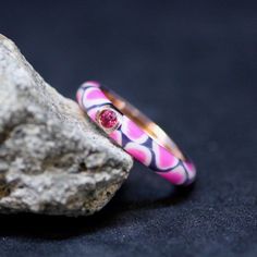 Handmade  Rose gold over Sterling Silver 925 Pink Sapphire Cubic Zirconias - lab made gems Pink Leopard Print Enamel Width of band 4mm September Birthstone 5th 45th Anniversary Gem I made these fun bands with a wild leopard print pattern. These would make lovely friendship rings or even wedding bands. I usually only have one of each size so check with me if you need two the same size. I usually make two or three at a time. Please note that because of the enamel they are not sizeable. If you are not sure of your ring size, any jewelry store will size your finger for you for free.  If I don't have your size ready to go, get ahold of me. I don't always have the time but if I do, I will be happy to make it up for you in your size. This will come in an organza bag . Cloisonné (French pronunciat Pink Enamel Rings For Gift, Rose Gold Enamel Ring, Multicolor Enamel Anniversary Ring, Pink Enamel Anniversary Ring, Round Enamel Ring With Bezel Setting As Gift, Pink Enamel Ring Fine Jewelry, Pink Enamel Ring For Anniversary, Round Gemstone Enamel Ring Gift, Round Enamel Ring With Gemstone For Gift