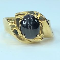 14k Yellow Gold Ring, It Features One Rare Black Star Sapphire (Selenite Cat's Eye" Gemstone. Measures 9.0 X 7.0mm Ring Rop 12.38mm, Ring Size 6.75, Weight 7.3 Grams, Hallmark 14k Black Star Sapphire, Star Sapphire Ring, Star Sapphire, Yellow Gold Ring, Black Star, Womens Jewelry Rings, Yellow Gold Rings, Gold Ring, Sapphire Ring