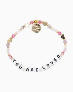 Add a trendy personal touch to your bracelet stack with this bracelet from the Little Words Project! The stunning assortment of beads offers plenty of color and texture, and the letter beads spell out ""YOU ARE LOVED"" - a message that's sure to inspire any day of the year.One size elastic stretch braceletHand-crafted crystal beaded braceletPlated brass hardwareHandle with care - do not wet Cute Things To Write On Bracelets, Meaningful Letter Beads Beaded Bracelet For Everyday, Everyday Inspirational Bracelets With Letter Beads, Everyday Inspirational Bracelet With Letter Beads, Inspirational Everyday Bracelets With Letter Beads, Friendship Letter Bead Charm Bracelet For Valentine's Day, Inspirational Pink Stretch Bracelet With Letter Beads, Inspirational Pink Letter Beads Stretch Bracelet, Friendship Bracelets With Letter Beads For Valentine's Day