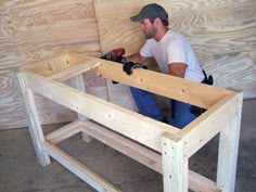 a man is working on some wood