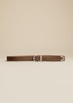 The Bambi Belt in Toffee Suede with Silver Luxury Belt With Rectangular Buckle, Modern Leather Belt Buckles With Palladium Hardware, Elegant Brown Calf Leather Belt, Designer Leather Belt Buckles With Palladium Hardware, Luxury Silver Belts With Palladium Hardware, Elegant Calf Leather Belt Buckles For Business, Elegant Silver Leather Belt Buckles, Modern Belts With Palladium Hardware For Business, Elegant Calf Leather Belt For Formal Occasions