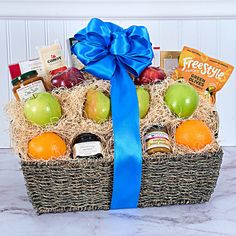 a gift basket filled with fruit and snacks