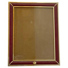 a red and gold frame on a white background with an empty space in the middle