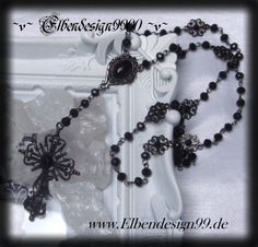 A very noble rosary in gothic style, which, like all my jewelry, was made with great care and attention to detail. The necklace was made of metal ornaments with black faceted glass beads & black glass stones. The pendant is approx. 11 cm long The chain is about 72 cm long If you prefer a different length, I will be happy to change that. Black Cross Jewelry For Halloween, Black Crucifix Jewelry For Jewelry Making, Vintage Black Rosary As A Gift, Vintage Black Rosary As Gift, Vintage Black Rosary Gift, Black Ankh Metal Jewelry, Gothic Cross Necklaces For Jewelry Making, Ankh Shaped Black Metal Necklace, Black Ankh Necklace In Metal