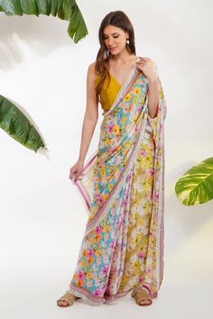 Multi color saree in with floral print and cutdana and pearl borders. Comes with an unstitched yellow blouse fabric.
Component: 2
Pattern: Printed
Type Of Work: Tropical Floral
Fabric: Viscose Satin Georgette; Blouse: Chanderi
Color: Multi Color
Other Details: 
Scalloped pearl border
Note: The blouse worn by the model is not for sale
Occasion: Mehendi and Haldi - Aza Fashions Summer Saree, Pearl Border, Blouse Stitching, Pearl Work, Print Saree, Saree For Women, Georgette Blouse, Printed Saree, Yellow Blouse