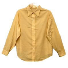 Ladies Vintage 1980’s Buttercup Yellow Long Sleeve Classic Cotton Button Up Shirt Size L/XL. This item does not have tags in it so the size listed is based on measurements. Measures 22” Armpit to armpit, 26” Long, 23” Sleeves. Excellent preowned condition, no rips stains or tears. From a smoke free home. Same or next day USPS First Class shipping. 90s Style Collared Shirt With Button Closure, Retro Top With Buttons, Vintage Style Solid Color Top With Button Closure, Vintage Style Solid Top With Button Closure, Vintage Solid Top With Button Closure, 90s Style Button-up Tops For Spring, 90s Style Buttoned Tops For Spring, 90s Style Long Sleeve Shirt With Button Closure, 90s Style Spring Tops With Buttons