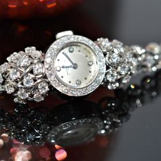 A ladies platinum and diamond 7 inch long wristwatch by Vacheron and Constantin.  The wind watch has a swiss movement with 17 jewels and is adjusted to temperature.  There are 134 round diamonds having a total approximate weight of 4.68 carats. The watch has been fully cleaned and serviced and is in working order. Judith Leiber Couture, Rose Gold Morganite, Vacheron Constantin, Diamond Anniversary Rings, Diamond Anniversary, Bezel Diamond, White Dial, Swiss Made, Morganite