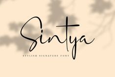 the word sintya is written in cursive font and surrounded by leaves