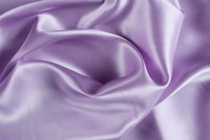 INFORMATION: This beautiful Stretch Charmeuse Sayin Fabric has a beautiful smooth shiny satin side with a modest matte finish on the back. The fabric is tightly woven and has a light 2-way vertical stretch, making it extremely durable. In addition, our stretch charmeuse is approximately 7 ounces per linear yard which is a better construction than most standard stretch charmeuse fabrics. This heavier gsm (grams per square meter) gives the fabric a richer feeling and a better hold when draping. Th Light Purple Dress, Feed Goals, Lavender Silk, Purple Silk, Luxury Silk, High Life, Silk Charmeuse, Stretch Satin, Flannel Fabric