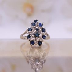 Vintage 14K White Gold Sapphire and Diamond Cluster Ring Size 6-1/4 - Etsy Classic Cluster Jewelry In 14k White Gold, Classic Cubic Zirconia Cluster Sapphire Ring, Classic 14k Gold Sapphire Ring With Silver Color, Classic Silver Cluster Ring In 14k Gold, Formal Cluster Ring In 14k White Gold, Timeless 14k White Gold Cluster Jewelry, Elegant Sapphire Ring In White Gold With 17 Jewels, Elegant White Gold Sapphire Ring With 17 Jewels, Timeless Sterling Silver Cluster Ring For Formal Occasions