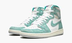 The Air Jordan 1 High “Turbo Green” is a unique colorway for the classic Michael Jordan signature shoe that released as part of the 2019 NBA All-Star collection from Nike and Jordan Brand.  The washed leather upper in Turbo Green and white pays tribute to the classic Charlotte Hornets team colors, the host team for the 2019 All-Star game, and gives the shoe a vintage look.  A gold and purple Nike logo is found on the tongue, and alternate purple laces are included to add to the Hornets vibe.  Th Jordan 1 Retro High Turbo Green, Turbo Green, Air Jordan 1s, Vert Turquoise, Purple Nikes, Exclusive Sneakers, Jordan 1s, Jordan 1 High Og, Jordan Sneakers