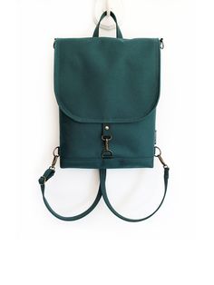 "Green Minimalist Backpack, Vegan Waterproof Bag, Emerald Crossbody Bag, St Patricks Day Bag, Teal Backpack, Forest Women Convertible Bag This elegant and versatile waterproof bag has multifunctional with more pockets. Comes with an adjustable and removable backpack/crossbody strap. The backpack constructed and fully lined with strong, durablity but lightweight Cordura fabric, has a spacious main compartment with one large zipper pocket and 3 multifunctional versatile and useful pockets are for Green Backpacks, Minimalist Backpack, Perfect Purse, Convertible Bags, Vegan Bags, Waterproof Bags, Large Backpack, Backpack Straps, Day Bag