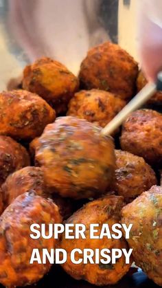 a close up of meatballs in a pan with the words super easy and crispy