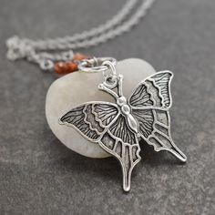 Butterfly Necklace  with faceted hessonite garnet gemstones with silver pewter ring & butterfly pendant. a perfect nature-inspired gift for a loved one, a special friend, or just for you! DETAILS  ♥  Pendant is 1.1/2 inches in length. ♥  On an 18-inch stainless steel chain. ♥  All of my pewters are lead-free. ♥  I use all-natural gemstones and freshwater pearls. SHIPMENT & DELIVERY ♥  All my items are ready to ship within 1-3 business days. ♥  Packages are typically shipped via USPS First Class Mail in 2-6 business days including tracking and delivery confirmation. KEEP SHOPPING WILDHAREGEMS Return to my main shop page here: ♥ https://www.etsy.com/shop/Wildharegems Nature-inspired Butterfly Charm Necklaces, Nature-inspired Sterling Silver Butterfly Jewelry, Bohemian Necklace With Butterfly Charm, Sterling Silver Butterfly Birthstone Jewelry, Silver Butterfly Jewelry With Birthstone, Nickel-free Brown Jewelry For Gifts, Brown Sterling Silver Jewelry For Gifts, Unique Nickel-free Butterfly Necklace, Bohemian Butterfly Charm Necklace As A Gift