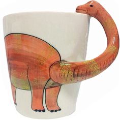 a ceramic mug with an elephant painted on it