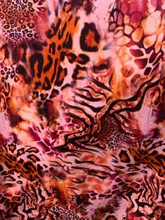 an animal print fabric is shown with different colors and patterns on the fabric, including red, pink, orange, black, and white