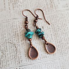 Artisan Stacked Turquoise Copper Teardrop Dangle Earrings EARRINGS ONLY Boho. I hung small copper alloy teardrops from a rustic stack of turquoise beads which fall from your choice antiqued copper earwires to make a pair of adorable dangle earrings.  You get Boho vibes, you get rustic vibes, you even get a Southwestern feel with the Turquoise.   If the teardrop pendant necklace in a few images speaks to you here is a direct link, https://magpiemadnessjewelry.etsy.com/listing/1758205629 REPEAT CU Turquoise Beaded Copper Earrings, Handmade Turquoise Earrings With Copper Wire, Turquoise Dangle Earrings With Patina, Turquoise Copper Dangle Jewelry, Turquoise Round Copper Earrings, Turquoise Boho, Teardrop Dangle Earrings, Boho Vibe, Turquoise Beads