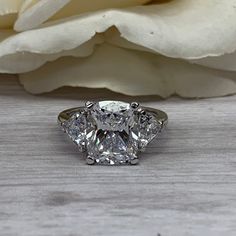 Moissanite Elongated Cushion Cut Engagement Ring, Elongated Cushion With Trillion Ring, 14K White Gold Ring, Gift For Her, #7010 #7011 #MoissaniteRing #14kWhiteGold #ElongatedCushion #Trillions #EngagementRing #BridalRings #AnniversaryGift #AnniversaryRing #GiftForHer #WeddingRing Elongated Vintage Inspired Rings, Luxury Timeless Moissanite Diamond Ring, Engagement Rings Elongated Cushion White Gold Diamond, Cushion With Trillion Side Stones, Elongated Cushion Engagement Ring Tiffany, Moissanite Elongated Cushion, Engagement Ring Elongated Cushion, Paraiba Tourmaline Engagement Ring, Elongated Cushion Cut Engagement Ring