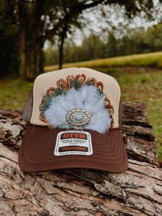 At FeatheredHavenCo, we pride ourself in our unique and fashionable designs . Our hats and apparel are crafted with premium materials and attention to detail, ensuring a timeless look that's both stylish and durable. From ranchers to rodeo riders, outdoor enthusiasts to fashion enthusiasts, our feather-adorned designs bring a touch of Western charm to any wardrobe. Adjustable Trucker Mini Hat With Short Brim, Adjustable Trucker Hat With Short Brim For Festival, Adjustable Snapback Hat For Rodeo With Short Brim, Brown Festival Trucker Hat, Brown Trucker Hat For Festival, Adjustable Snapback Hat For Country Events, Western Style Brown Adjustable Baseball Cap, Western Style Adjustable Brown Baseball Cap, Adjustable Brown Western Baseball Cap