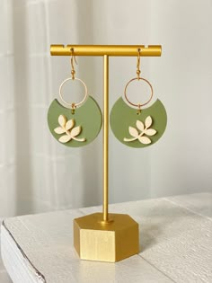 "Beautiful Laser cut acrylic earrings. Olive green leaf on the lightest peach colored acrylic or  Light Peach colored leaf on olive green acrylic.  The perfect earrings for your wardrobe. Beautiful, lightweight and super cute on.  They go with everything! Dress them up for a night out or wear them with your everyday outfits.   * Cut from 1/8\" acrylic * acrylic suspends from gold or silver connector and earring hooks. - Laser Cut Acrylic  - Hand Assembled  CARE * colors may differ slightly from Laser Cut Earrings Template, Laser Cut Acrylic Earrings, Acrylic Earrings Laser Cut, Laser Earrings, Laser Cut Jewelry Acrylic, Laser Cut Earrings Acrylics, Wood Jewelery, Light Peach Color, Laser Cut Wood Earrings