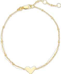 a gold heart bracelet on a white background