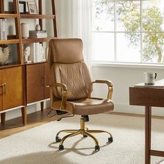 a brown office chair sitting on top of a white rug in front of a window