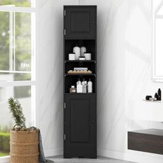 a tall black cabinet sitting next to a window