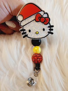 Adorable HK Santa Badge Reel. Available with beads. Beads may vary.  Message me if you have a color preference. I'd be more than happy to customize it for you. Badge reels are attached with 3M dual lock velcro and are interchangeable. If you prefer a permanent glue please send me a note when you purchase.  Care instructions: Please avoid dropping, while items are durable they are not indestructible. Please handle with care. RETURNS/EXCHANGES: Due to all items being personalized and made to order we do not accept returns or exchanges. If there are any issues with your order you must notify us within 24 hours of delivery. Thank you! CHANGE OF ADDRESS: Please Double check your address as you are checking out. We are not responsible for packages that are lost due to wrong address. Personalized Fun Badge Reel For Gift, Personalized Fun Badge Reel Gift, Customizable Fun Badge Reel For Gifts, Personalized Round Beads Craft Supplies For Gifts, Adjustable Fun Badge Holders For Gifts, Multicolor Badge Holder With Keychain For Gifts, Multicolor Badge Holder With Keychain As Gift, Multicolor Badge Holders With Keychain As Gift, Personalized Cute Badge Reel For Gift