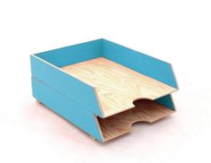 a wooden box with a blue top and bottom section cut out to show the inside