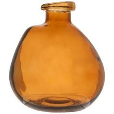 a brown glass vase sitting on top of a table