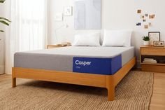 a bed with a blue casperer mattress on it