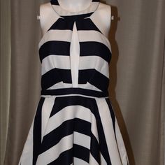 Mini Dress With Open Back. Navy And White Stripes. Mesh Detail On Back. Striped Lined Mini Dress For Party, Elegant Striped Mini Dress For Summer, Chic Striped Party Dress, Elegant Striped Dress For Date Night, Striped Lined Party Dress, Party Striped Lined Dresses, Striped A-line Party Dress, Striped Summer Evening Dresses, Striped Evening Dresses For Summer