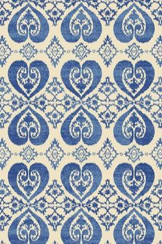 a blue and white rug with hearts on it